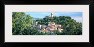 Buildings surrounded by trees, Montefortino, Province of Ascoli Piceno, Marches, Italy