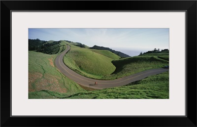 California, Marin County, Bolinas Ridge, Person cycling on the road