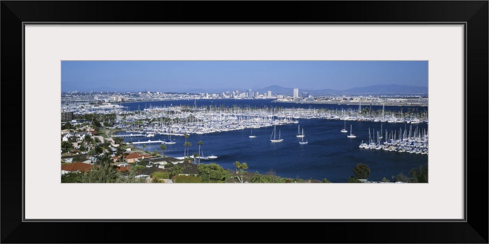 A panoramic aerial view of the boats in the water of San Diego harbor.