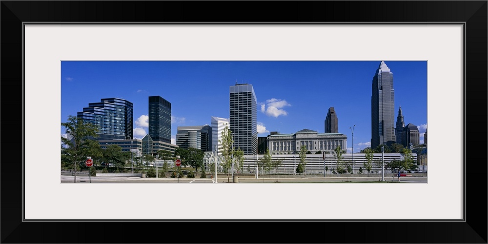 Panoramic photograph taken of the Cleveland skyline on a bright sunny day.