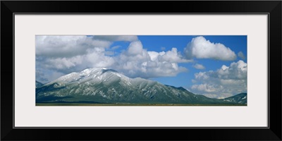 Clouds over snowcapped mountains, Taos, New Mexico