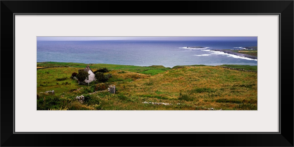 Coastal landscape with white stone house, Galway Bay, The Burren region, Ireland