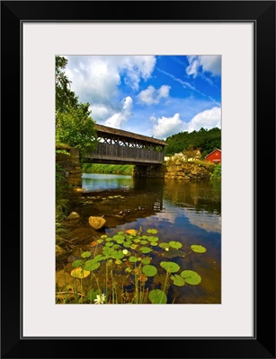 Covered bridge across a river, Vermont