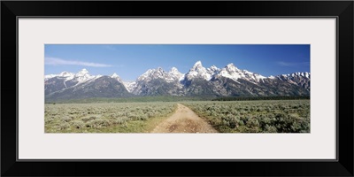 Dirt road passing through sage brush, Grand Teton National Park, Wyoming