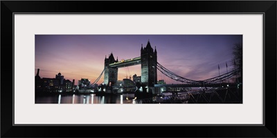 Drawbridge lit up at dusk Tower Bridge Thames River London England