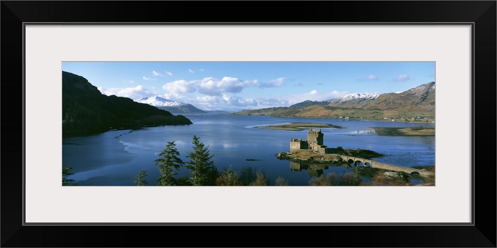 Aerial photograph of the Eilean Donan castle on an island where the three great sea lochs meet in Scotland.