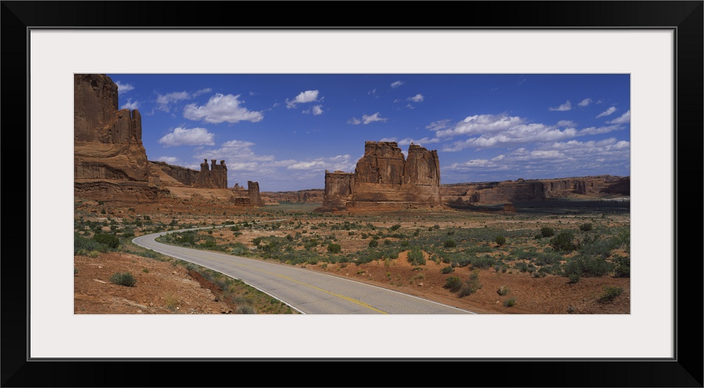 Empty road running through a national park, Arches National Park, Utah