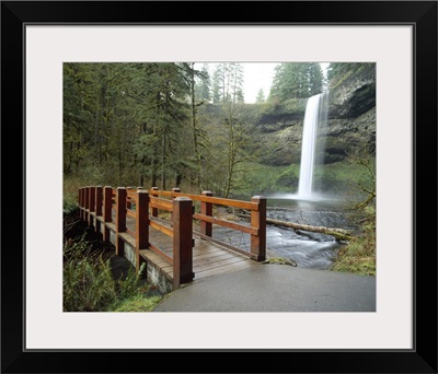 Footbridge across a river with a waterfall in the background Silver Falls State Park Salem Oregon