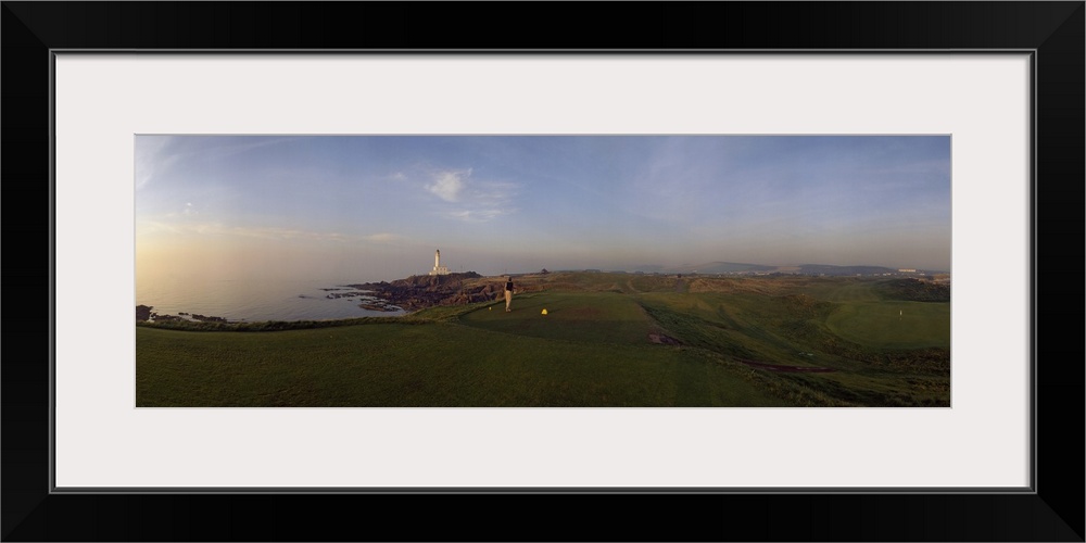 Golf course with a lighthouse in the background, Turnberry, South Ayrshire, Scotland