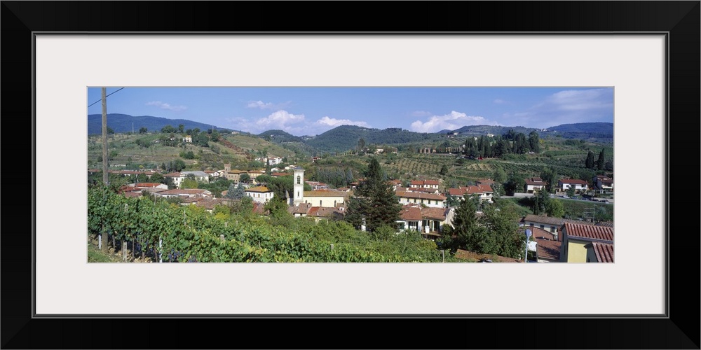 Panoramic canvas photo of an Italian town on rolling hills.