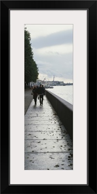 Group of people walking along a river, Neva River, St. Petersburg, Russia