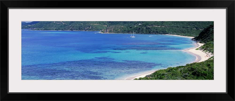 Gorgeous colored water in the Caribbean is photographed from a distance off the coast of the Grand Cayman island.