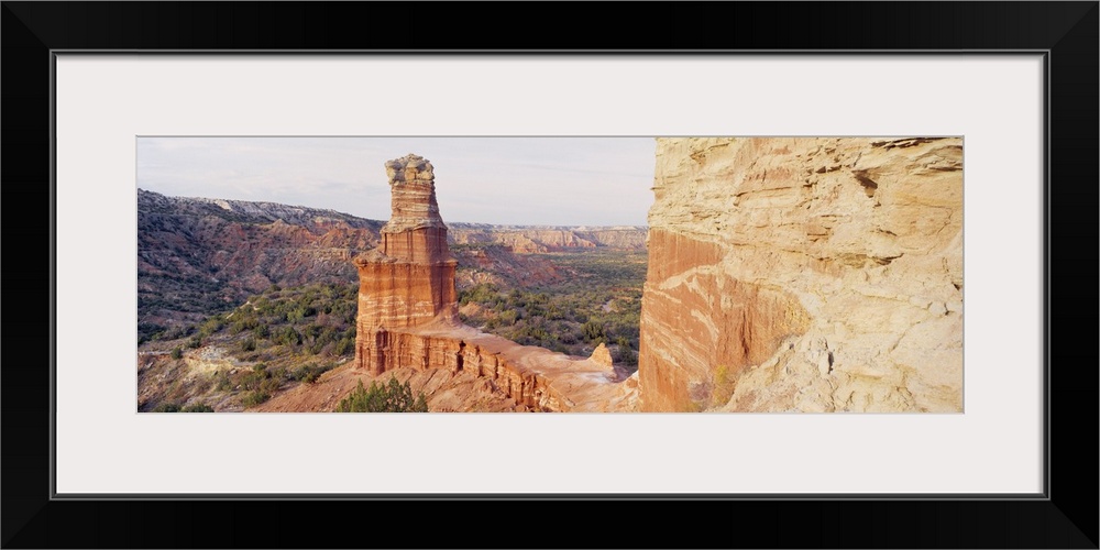 Long photo print of rock formations in the desert in Texas.