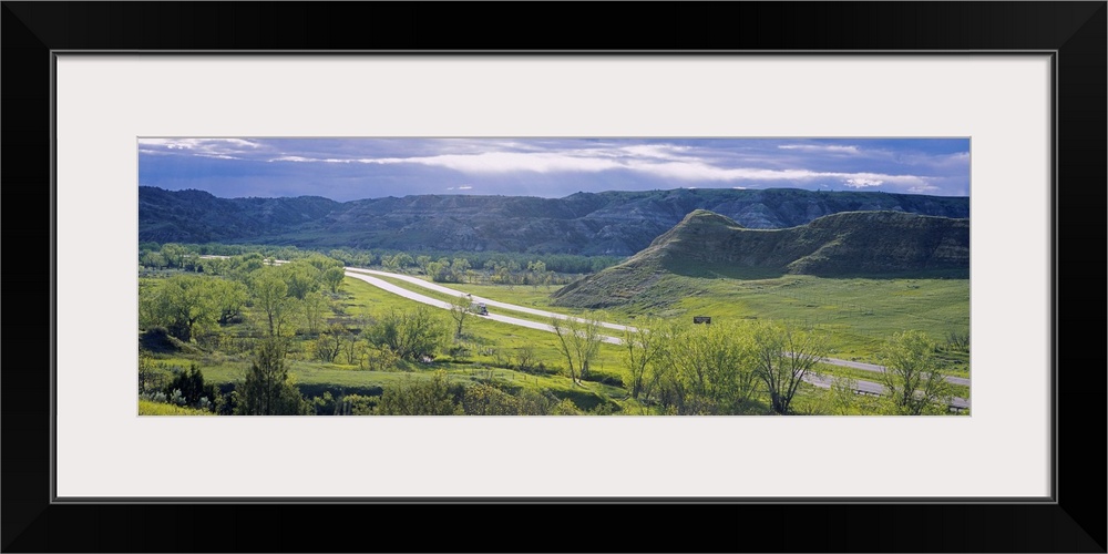 Highway passing through a landscape, Interstate 94, Badlands, Theodore Roosevelt National Park, North Dakota