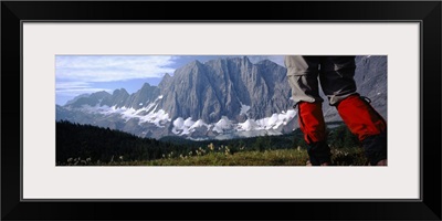 Hiker walking in a meadow, Floe Lake, Glacier National Park, British Columbia, Canada