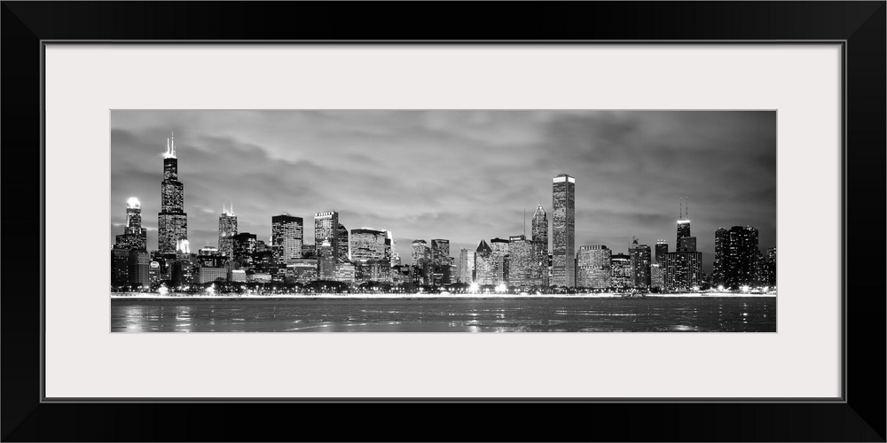 Black and White panoramic photograph showing the view from Lake Michigan in winter of the Chicago skyline of the downtown ...