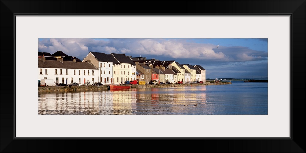 Long horizontal photo print of colorful Irish buildings and houses along the waterfront.