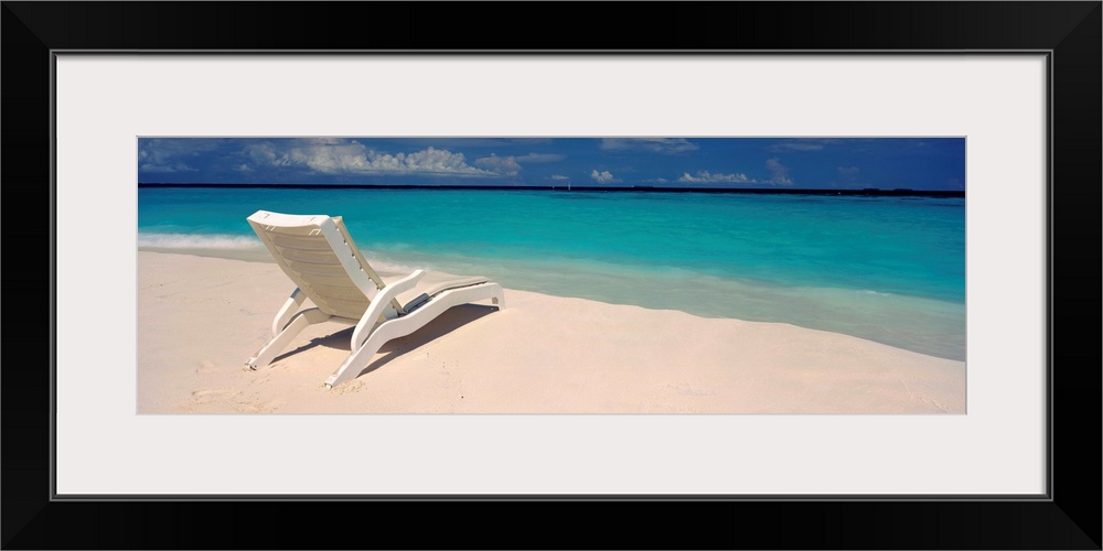 Lounge chair on the beach, Thulhagiri Island Resort, North Male Atoll, Maldives