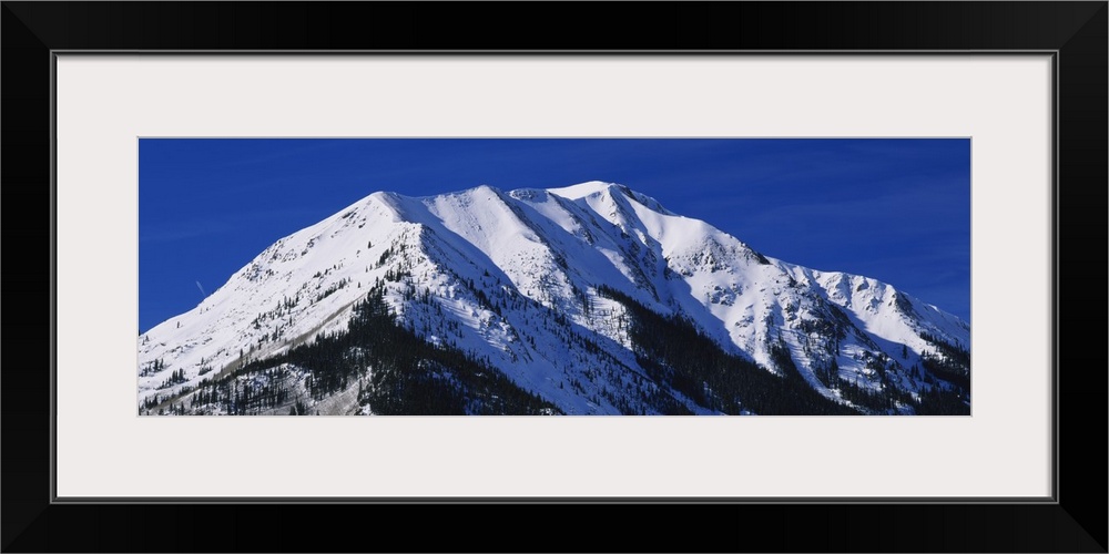 Low angle view of a snow covered mountain, Rocky Mountains, Twin Lakes, Colorado