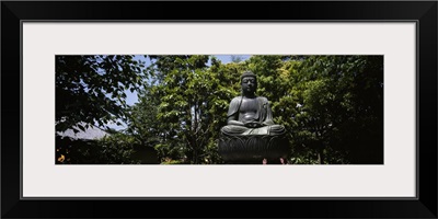 Low angle view of a statue of Buddha in a temple, Asakusa Kannon Temple, Tokyo Prefecture, Japan