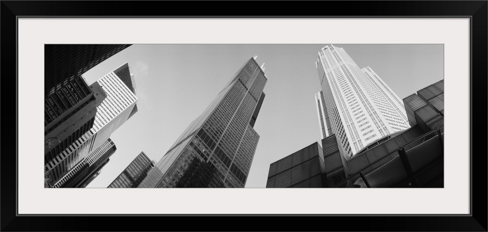 View from the bottom looking up at big buildings in Chicago on canvas.