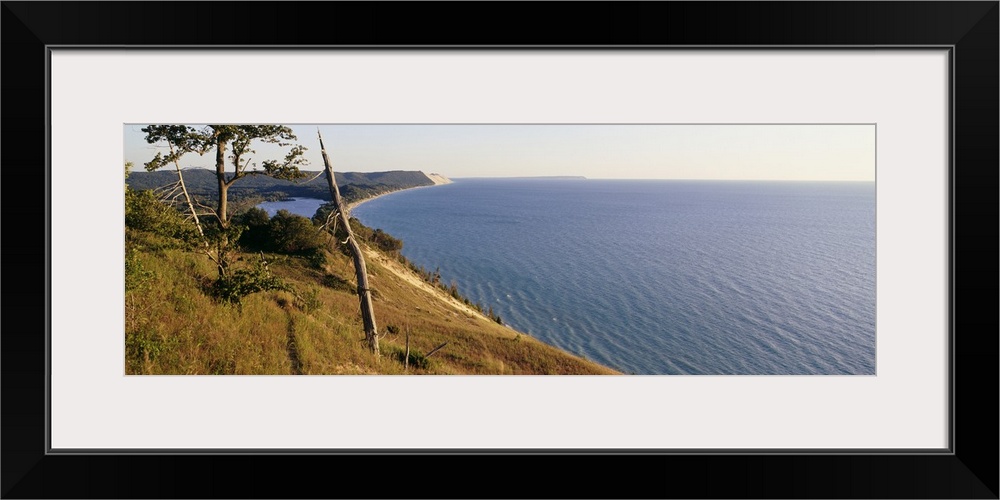 Panoramic photograph taken of a national park in Michigan with a vast view of Lake Michigan to the right and the coast of ...