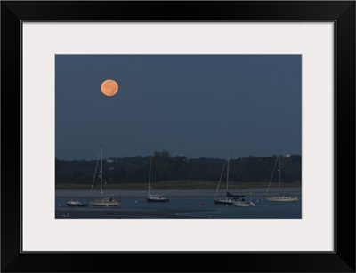 Moonset over a river, Annisquam River, Annisquam, Gloucester, Cape Ann, Massachusetts