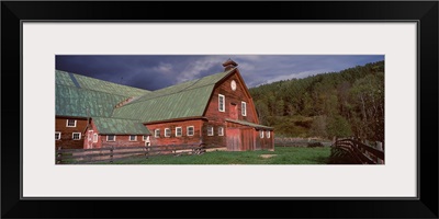 Old red barn with green rooftops in a farm, Vermont,