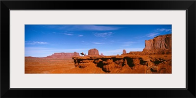 Person riding a horse on a landscape, Monument Valley, Arizona