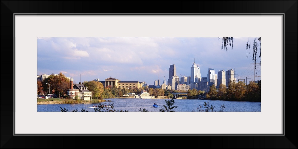 This panoramic photograph includes a view of the city skyline, the art museum, and the Schuylkill River shore.