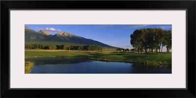 Pond in a golf course with mountains in the background, Former Great Sand Dunes Country Club, Great Sand Dunes National Monument, Colorado