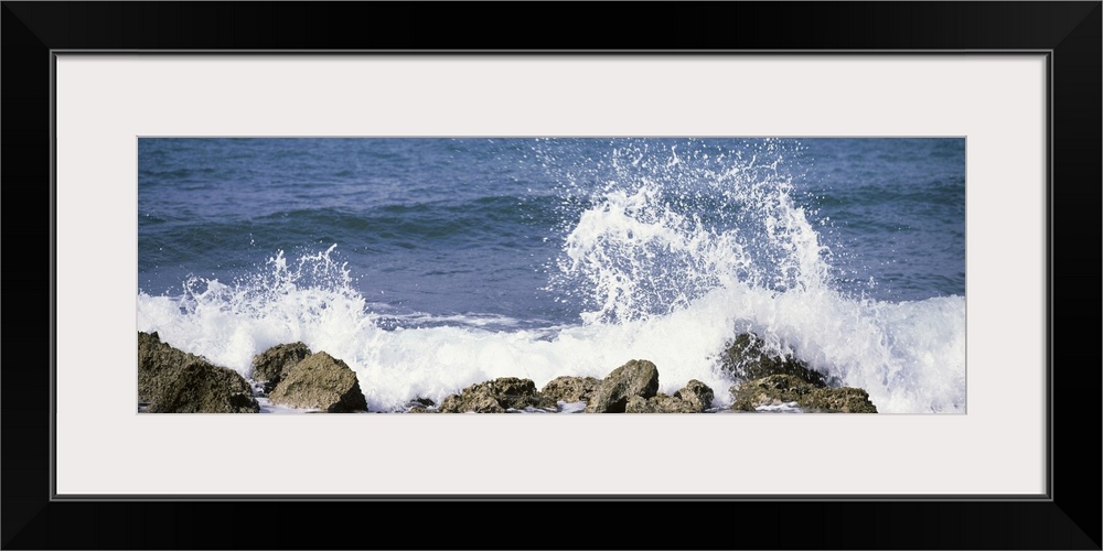 Puerto Rico, Vieques, Water splashing with rocks on the beach