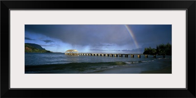 Rainbow over a pier, Hanalei, Kauai, Hawaii