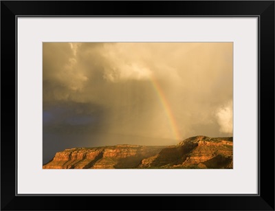 Rainbow Over Desert Landscape With Mesas