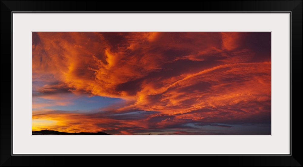 Red dramatic sky during sunset, Taos, Taos County, New Mexico, USA.