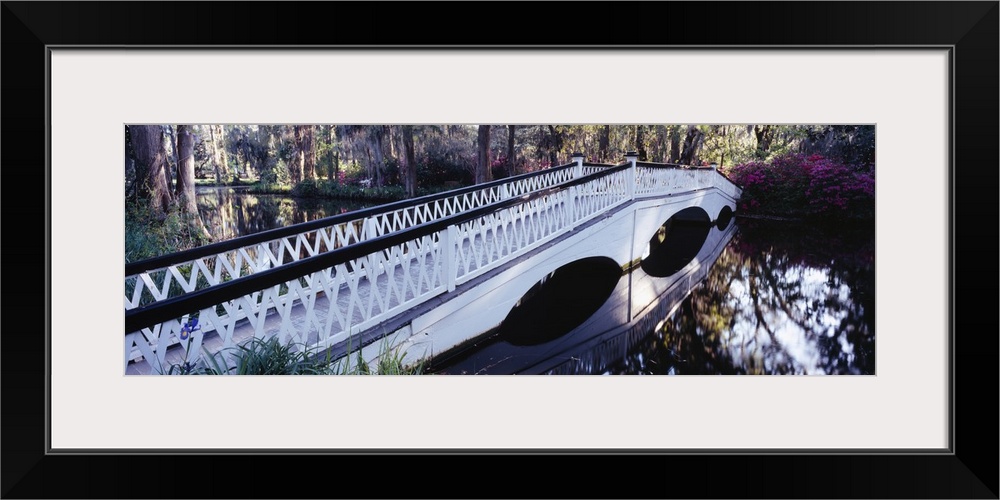 Reflection of a bridge in water, Magnolia Plantation and Gardens, Charleston, South Carolina