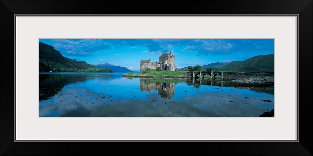 Reflection of a castle in water, Eilean Donan Castle, Loch Duich, Highlands, Scotland