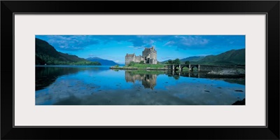 Reflection of a castle in water, Eilean Donan Castle, Loch Duich, Highlands, Scotland