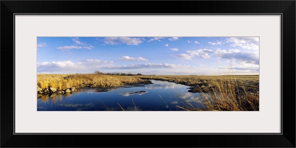 Reflection of clouds in a lake, Prairie Pothole Region, North Dakota