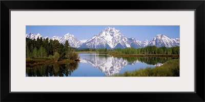 Reflection of mountains and trees in a river, Oxbow Bend, Snake River, Grand Teton National Park, Wyoming,