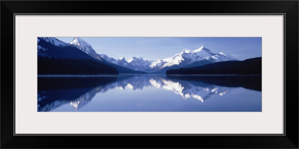 Reflection of mountains in a lake, Maligne Lake, Jasper National Park, Alberta, Canada