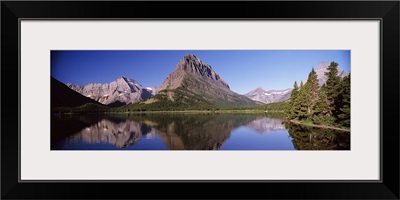 Reflection of mountains in a lake, Swiftcurrent Lake, Many Glacier, US Glacier National Park, Montana,