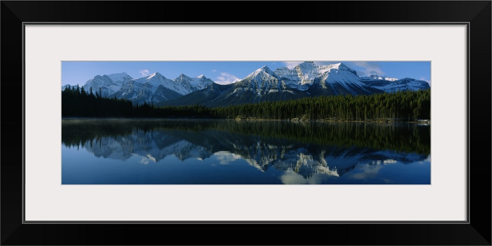 Reflection of mountains on water, Herbert Lake, Banff National Park, Alberta, Canada