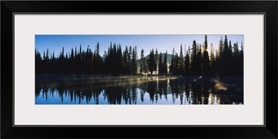 Reflection of pine trees in a lake, Sparks Lake, Deschutes County, Oregon