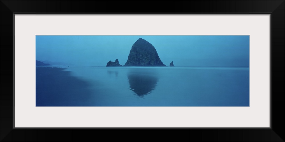 Reflection of rock in water, Haystack Rock, Cannon Beach, Clatsop County, Oregon