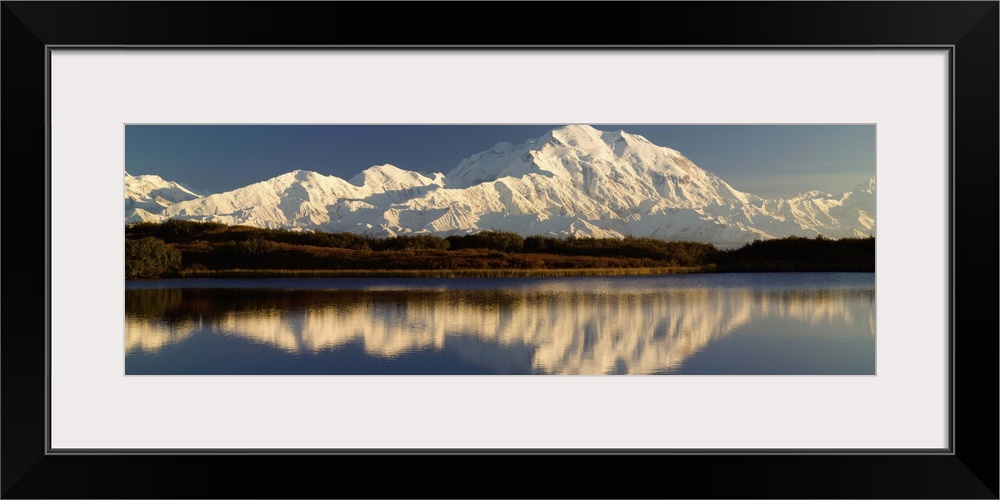 Reflection of snow covered Mt McKinley in water, Denali National Park, Alaska