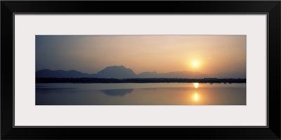 Reflection of sun in a lake, Western Ghats Hills, Tamil Nadu, India