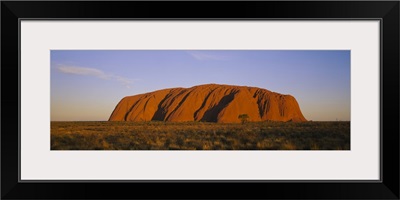 Rock formations on a landscape, Ayers Rock, Uluru-Kata Tjuta National Park, Northern Territory, Australia