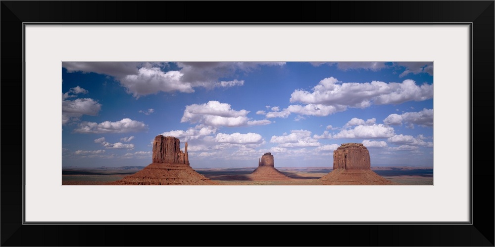 Rock formations on a landscape, The Mittens, Monument Valley, Arizona