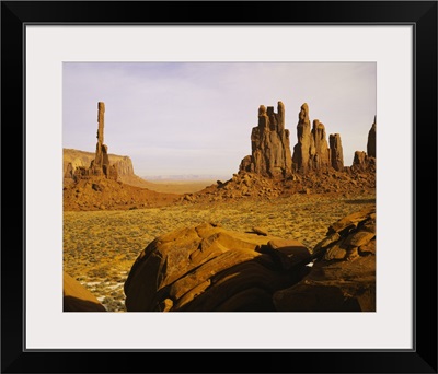 Rock formations on a landscape, Totem Pole Rock, Yei Bi Chei, Monument Valley Tribal Park, Arizona